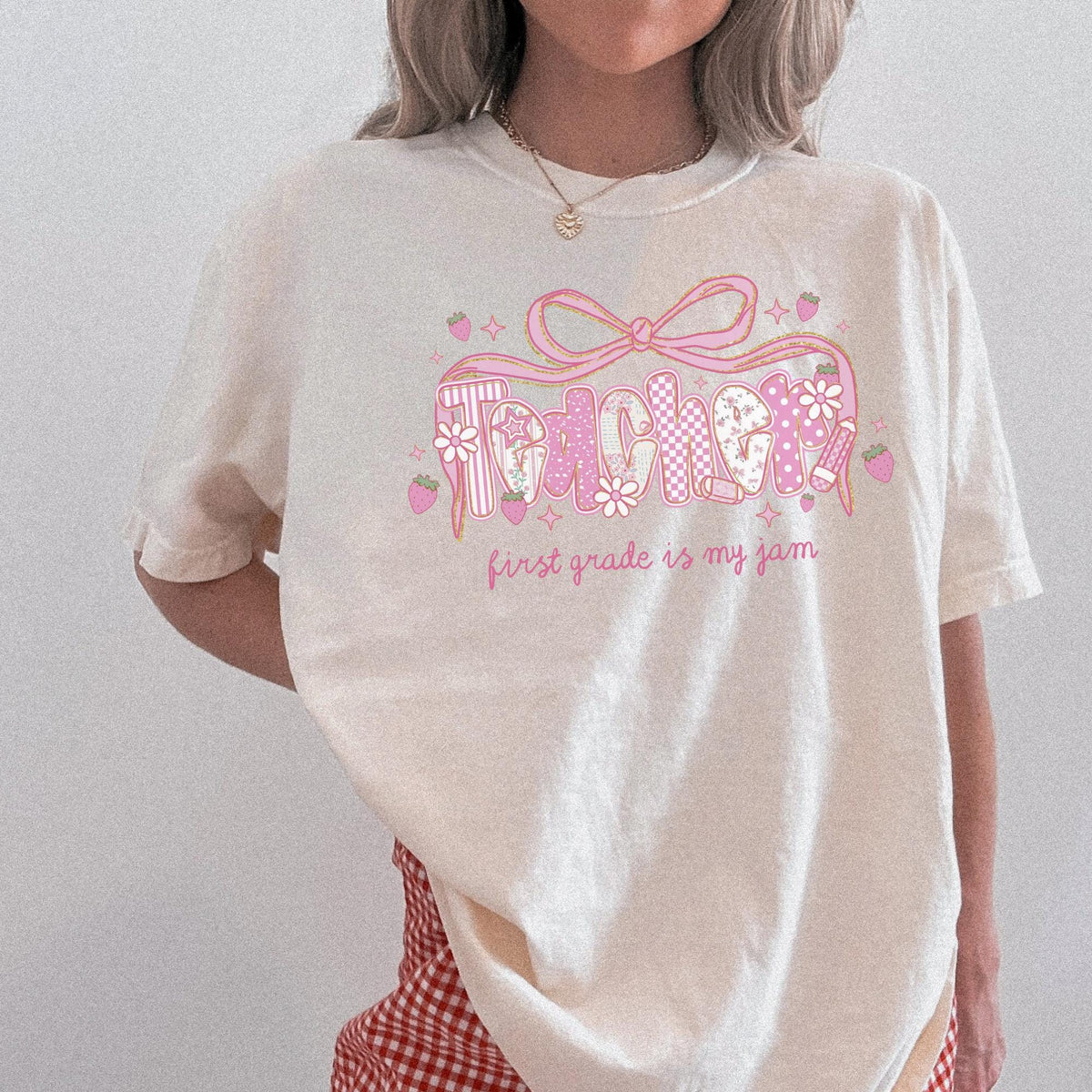 First Grade Teacher Tee Shirt for First Grade Squad or Crew Floral Boho Strawberry TShirt with Messy Coquette Bow Fruit Lover Teacher Graphic Tee – Warm & Stylish · Trending Graphic Apparel