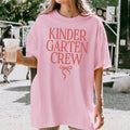 Kindergarten Crew Matching Teacher Tee Shirt with Messy Coquette Bow Colorful Kindergarten Teacher Tee for Back to School Meet the Teacher Graphic Tee – Soft Feel · Trending Graphic Apparel
